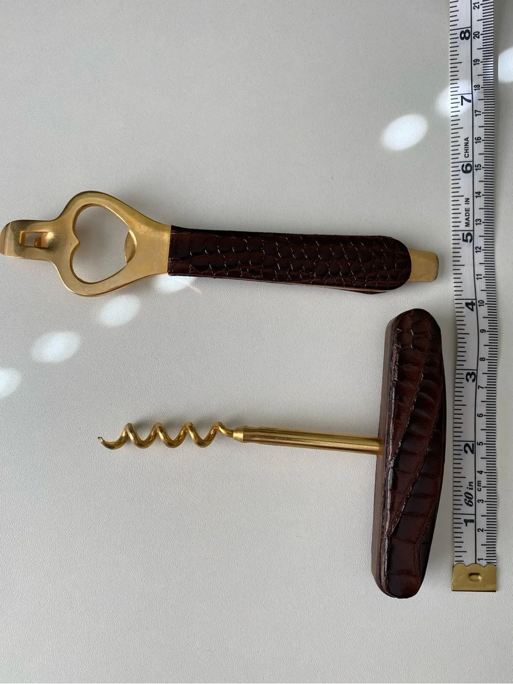 Vintage mid-century brass and faux-crocodile leather bar set.